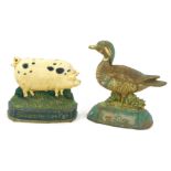 Two cast iron door stops, comprising a mallard duck, 22cm high, and a Gloucestershire pig, 18cm high