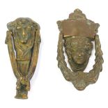 Two brass door knockers, each with Medussa mask handle and swag decoration, 20cm and 18cm high. (2)