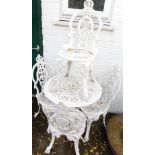 A cast aluminium garden table and four chairs, white painted.
