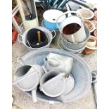 A group of galvanised wares, comprising galvanised tub, four watering cans, six buckets, enamel bin,
