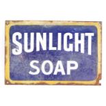 A Sunlight Soap advertising enamel advertising sign, with a yellow border on blue and white central