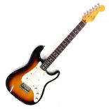 A Fender Stratocaster electric guitar, six string, in cream and vinyl finish, no.323681, 99cm long.,