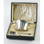 A George V silver christening set, comprising two handed bowl, by Munsey & Co, Sheffield, 1928, 6cm
