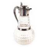 A Victorian silver and cut glass claret jug, with compressed domed lid, thumb mould handle, plain S