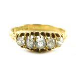 An 18ct gold diamond gypsy ring, set with five old cut diamonds, each in claw setting with scroll de