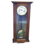 A late 19thC walnut cased Vienna wall clock, with 17cm diameter, Roman numeric dial in a three part