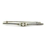 A blister pearl and paste stone set bar brooch, on a white metal band stamped 900, 5.5cm wide, 3g, b