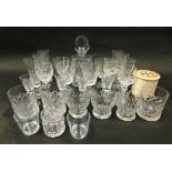 Various crystal glassware, a decanter, drinking glasses, champagne flutes and an enlarged Sylko cott