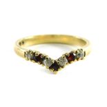 A 9ct gold wishbone ring, set with garnets and CZ, each in claw setting, ring size O½, 2.3g all in.