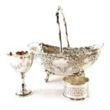 An Edwardian silver plated basket, with swing handle, repousse decorated floral and scroll body, and