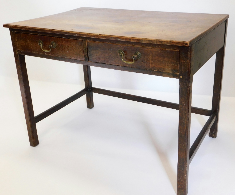 A 19thC oak side table, the rectangular top above two frieze drawers, on chamfered legs.