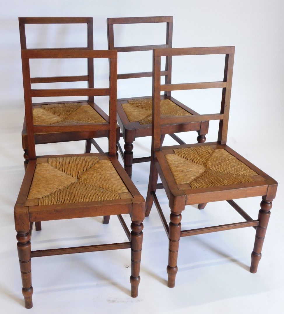 A set of four late 19th/early 20thC mahogany ladder back dining chairs, each with a rush seat on tur - Bild 2 aus 2