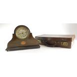An Edwardian mahogany boxwood strung mantel timepiece, in Napoleon hat shaped case, with silvered di
