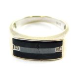 A 9ct white gold gentleman's signet ring, with rectangular bar set with black agate and tiny diamond