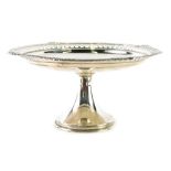 A George V silver tazza, with floral part pierced border, on an inverted stem and circular foot, Lon