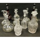 Various decanters, to include a matched pair of flash ruby glass examples with stoppers, each approx