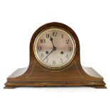A mid 20thC Napoleon hat mantel clock, with 14cm diameter Roman numeric dial, on compressed bracket