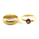 Two rings, comprising a 9ct gold wedding band with outer reeded design, ring size P and a cut band s