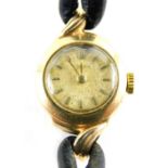 A Rodania 9ct gold cased ladies wristwatch, with small circular watch head, on a black leather strap