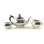 A George V silver three piece tea service, by Joseph Gloster, comprising teapot of cape form, with e