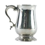A George III silver mug, by Peter and Ann Bateman, acanthus leaf handle, plain body and circular foo