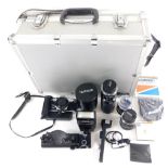 Withdrawn Pre Sale by Vendor. An Olympus OM-2N camera, 11cm high, and a quantity of various lens, a