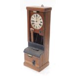 An early 20thC Time Recorders National time clock, booking in clock, with 23cm diameter Roman numeri