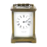 A 20thC Reed & Sons carriage clock, in five part glazed brass case with swing handle, 6cm back plate