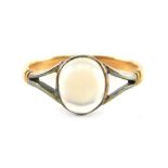 A moonstone dress ring, the oval moonstone in a rubover white gold setting with V splayed shoulders