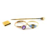 Three items of jewellery, comprising a 9ct gold and amethyst dress ring, ring size I, a yellow metal