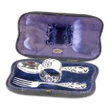 A late Victorian silver Christening set, by Josiah Williams and Co, comprising spoons, fork, and nap