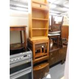 A pine open bookcase, nest of Jig style tables and a side cabinet.