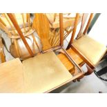 A pair of Queen Anne style walnut chairs, and an open bookcase.