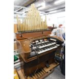 A Conn electric organ, with faux pipes.