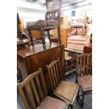 A walnut two door cupboard, a set of three oak dining chairs, and an Edwardian walnut chair.