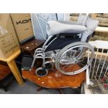 A Folding wheelchair, Italian style coffee table, and nest of two tables.