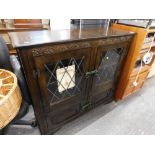 A Stanleywood Old Charm style side cabinet with lead glass panel doors.