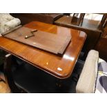 A Victorian mahogany extending dining table on turned legs terminating in castors.