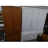 A painted triple wardrobe in cream and an Alsons double wardrobe with drawer to base.