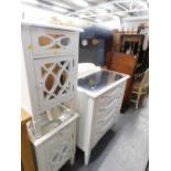 A glass topped side cabinet and two pedestal cabinets each with lattice work fronts