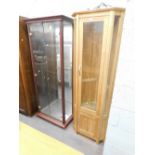 A light oak corner display cabinet and a further display cabinet