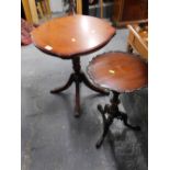 A mahogany finish wine table on quadruple legs, terminating in brass paw castors, and tripod wine ta