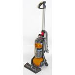 A Dyson DC24 upright vacuum cleaner.