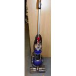 A Dyson DC24 upright vacuum cleaner.