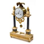 A late 19thC Louis XVI style French marble and ormolu portico clock, with circular enamel dial beari