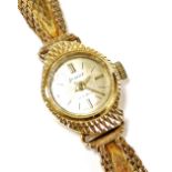 An Accurist lady's 9ct gold cased wristwatch, circular champagne dial with gilt batons, twenty one j