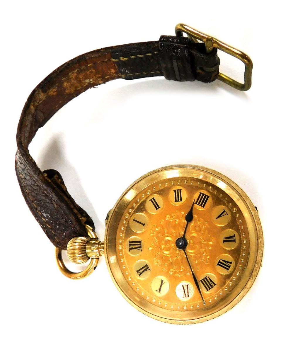 An early 20thC lady's fob watch, stamped 18k, open faced, keyless wind, the circular dial bearing Ro