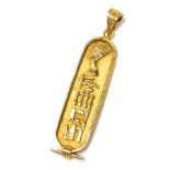 An Egyptian hieroglyphs pendant, of oval form, yellow metal, 5.3g.