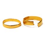 A 22ct gold wedding band, cut, and a further 22ct gold wedding band, misshapen, 3.4g.