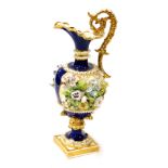 An early 19thC Crown Derby porcelain ewer, of baluster form, encrusted with flowers, against a cobal